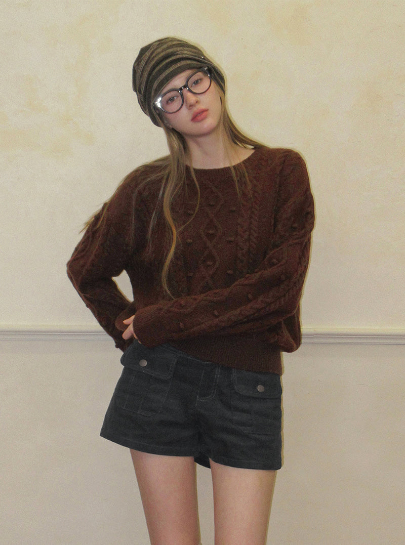 TWEE Kuti cable pattern round neck long sleeve knit | Product styling view 3