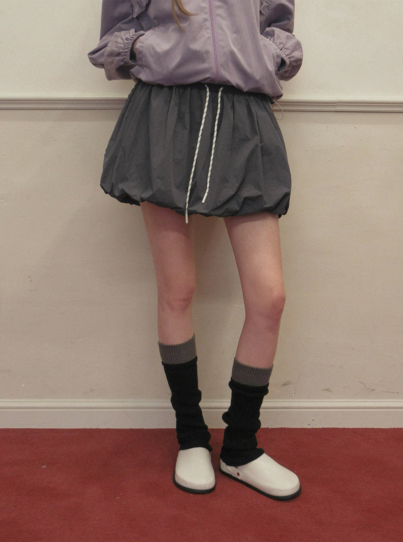 TWEE Colt nylon balloon banding mini skirt | Product styling view 6