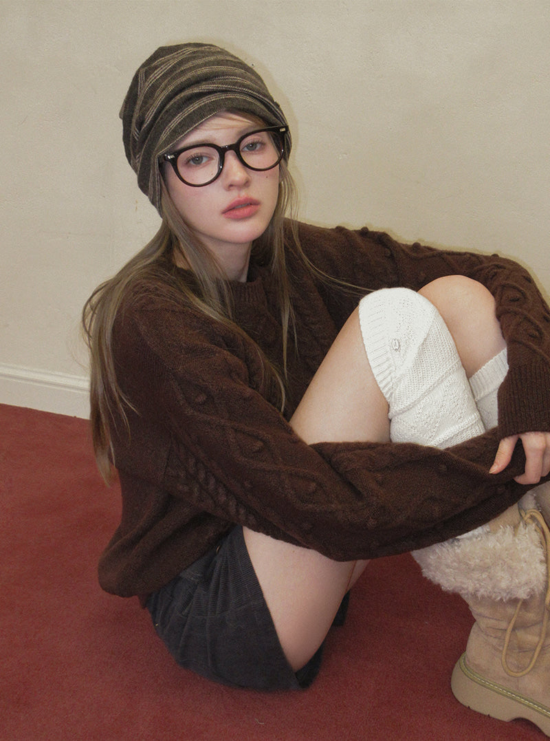 TWEE Kuti cable pattern round neck long sleeve knit | Product styling view 5