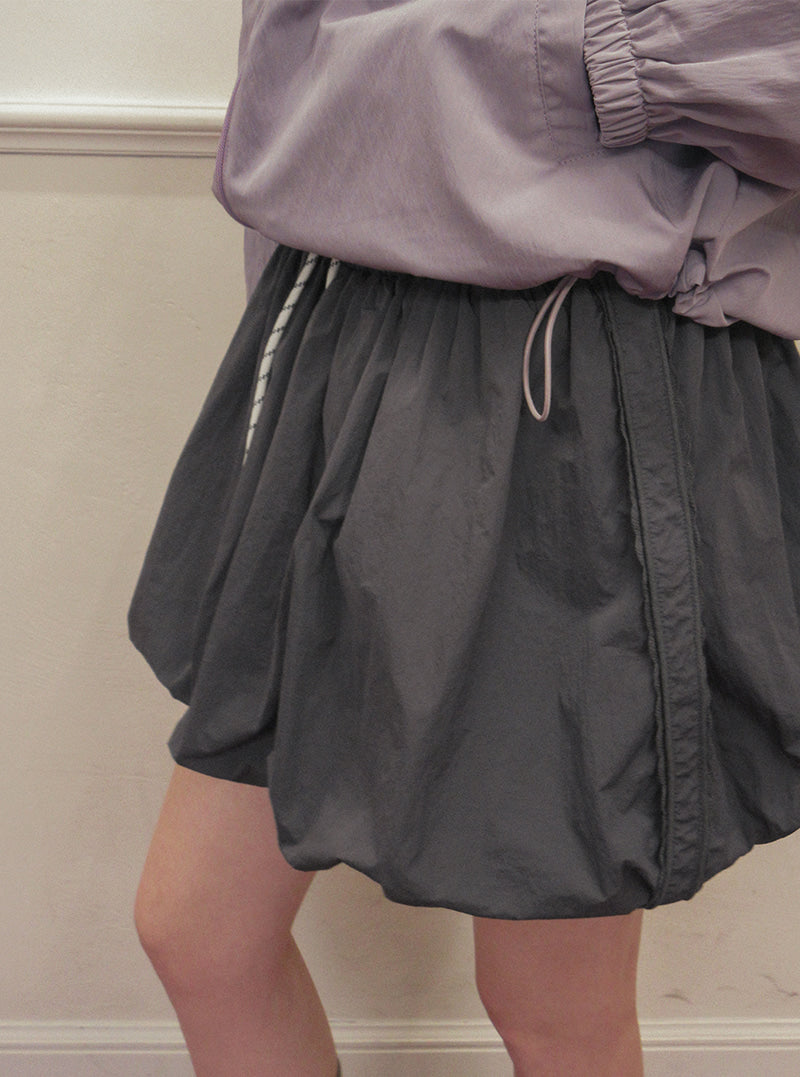 TWEE Colt nylon balloon banding mini skirt | Product styling view 5
