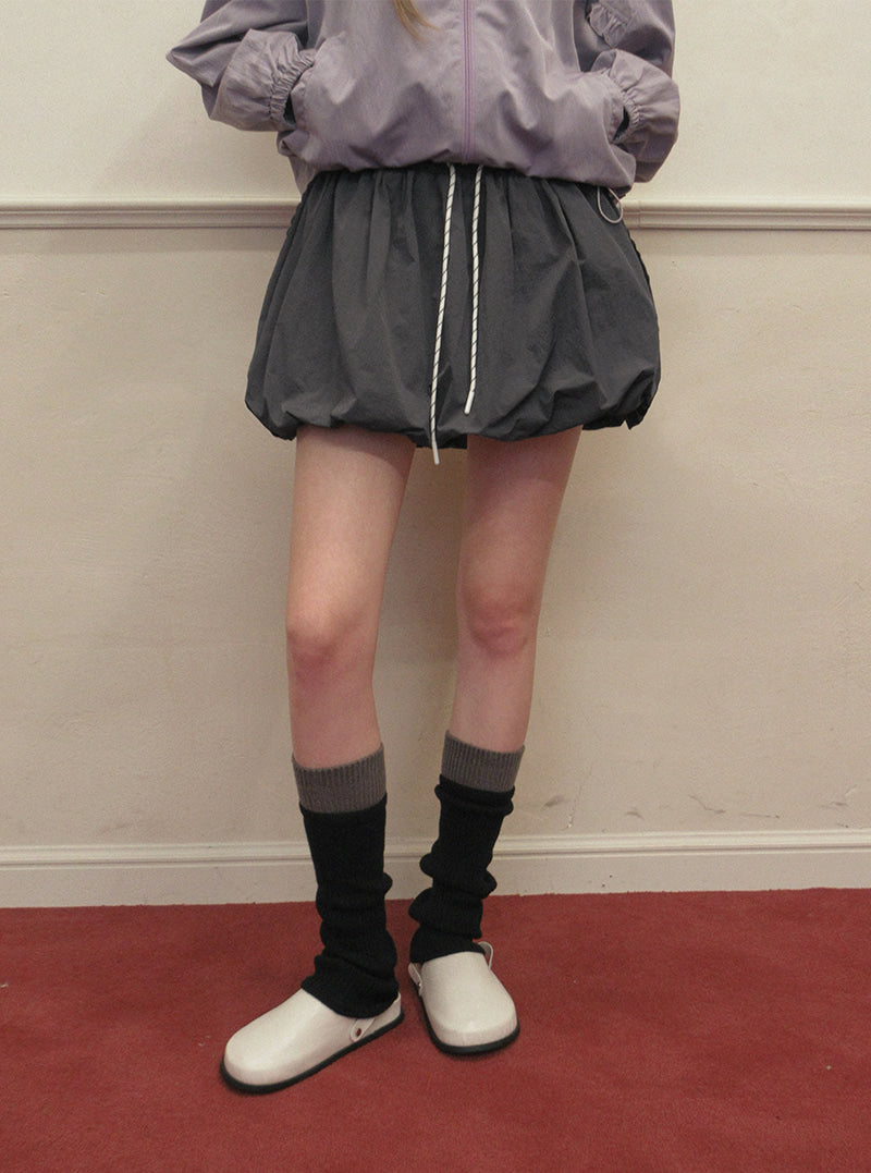 TWEE Colt nylon balloon banding mini skirt | Product styling view 3