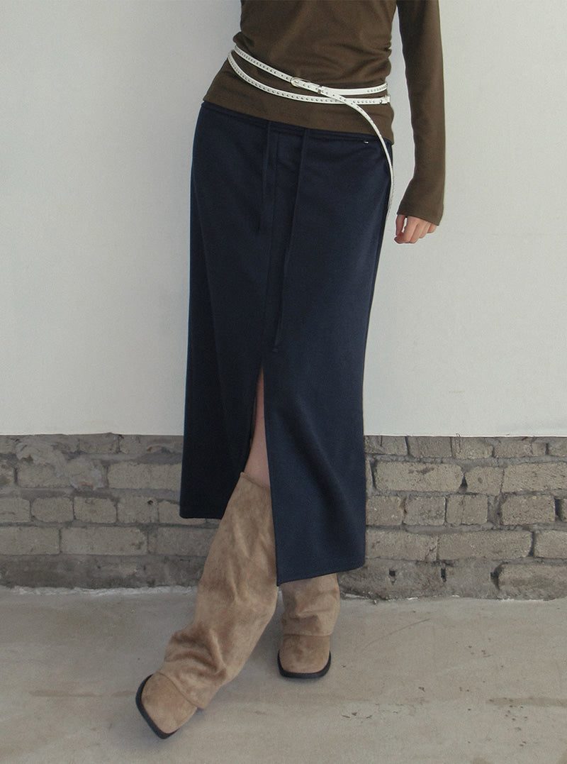 TWEE Tini folding front slit long skirt | Product styling view 8